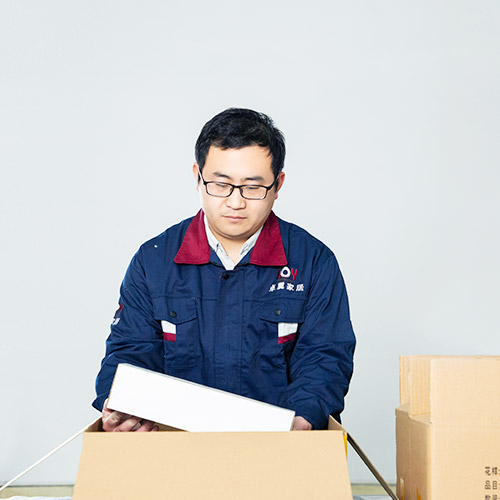 worker packing in stock classical cutlery