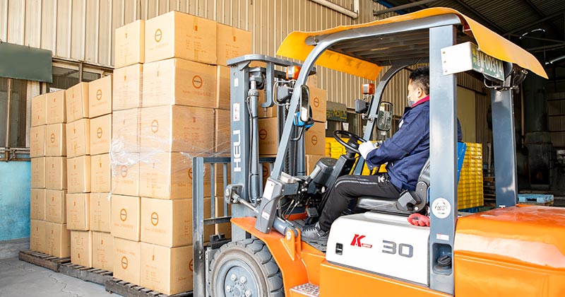 worker using forklift to get package deliver ready